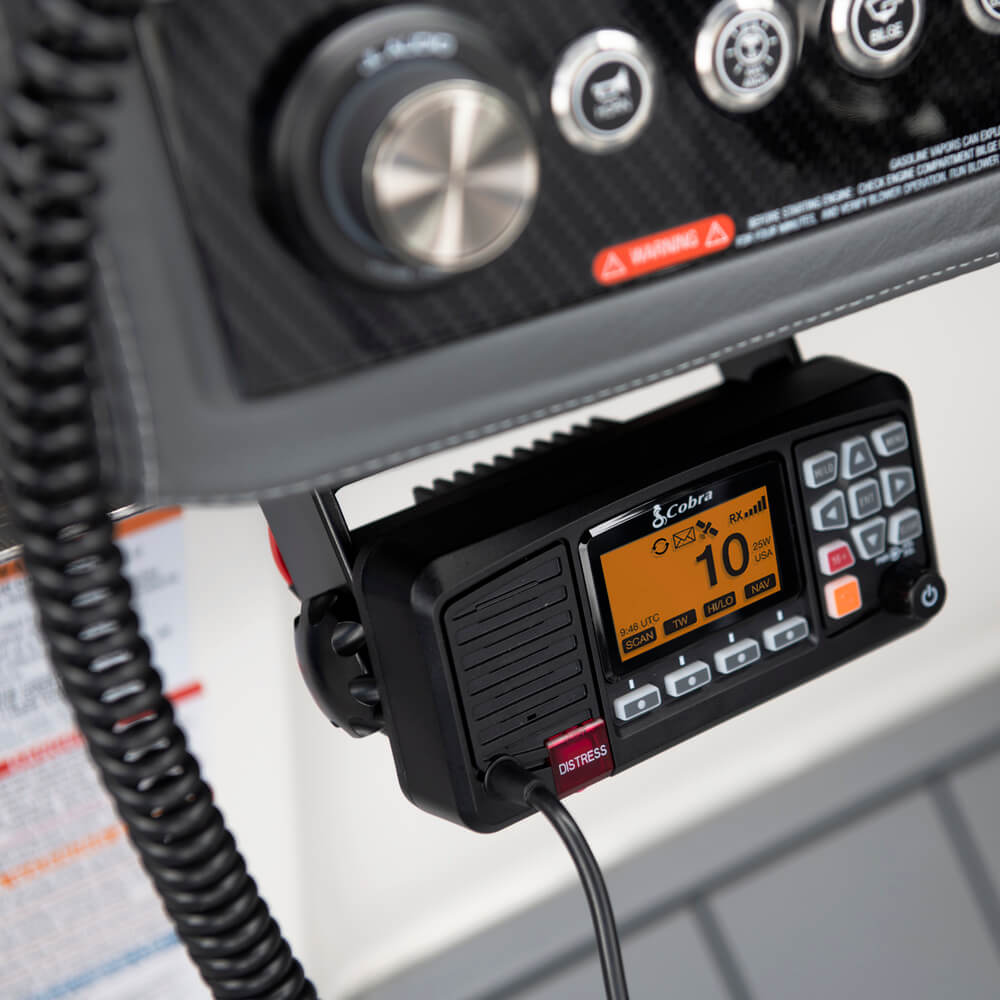 Black Cobra BlueBound 1350 fixed mount marine radio with display and buttons on a boat dashboard