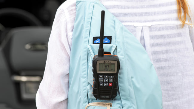 Cobra BlueBound marine radio clipped to a backpack