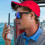 Boater communicating with marine radio