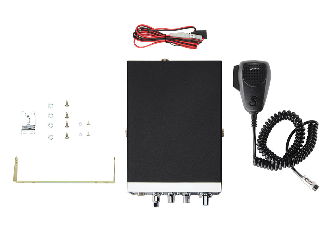 Cobra 25 LTD AM/FM CB Radio box contains radio, handheld, power cable, and mounting bracket with screws