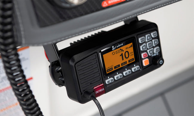 Cobra BlueBound 1350 marine radio with display and buttons on a boat dashboard