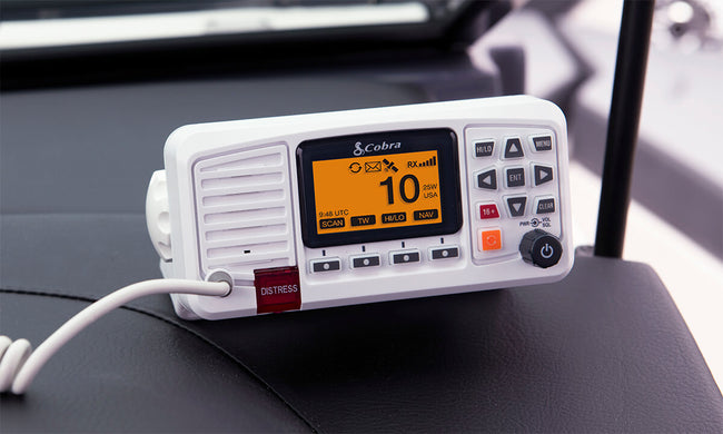 White Cobra BlueBound 1350 fixed mount marine radio with display and buttons on a boat dashboard