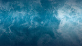 blue ocean with white foam waves