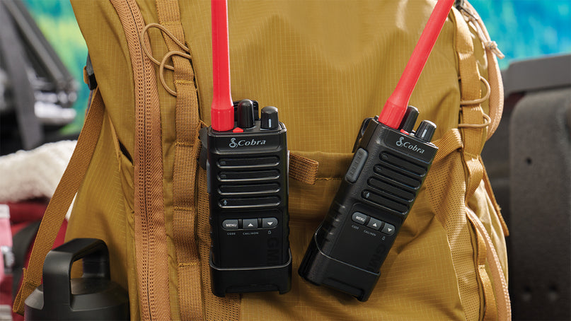 Cobra Trailblazer 500 GMRS radios clipped to a backpack
